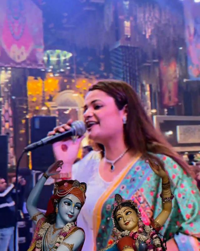 Paaridhi Sharma singing bhajans beside Radha Krishna idols
