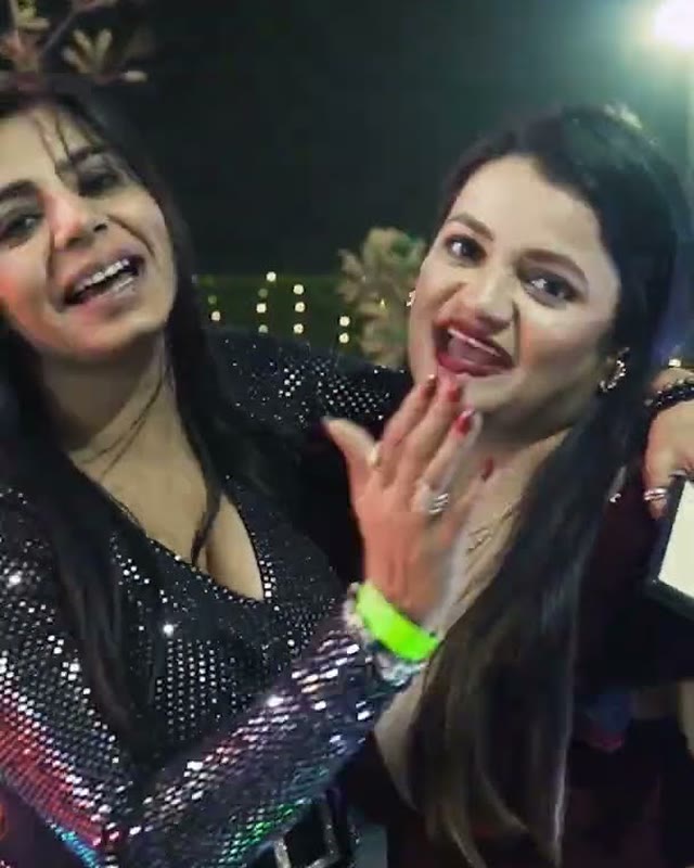 Two guests giving feedback on the floor at a night function